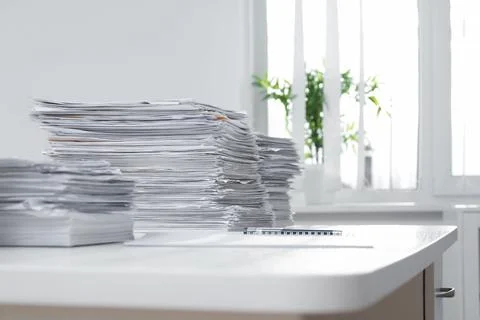 Stacks of documents on table in office Stock Photos