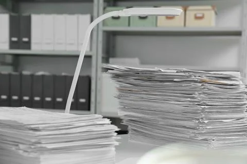Stacks of documents on table in office Stock Photos