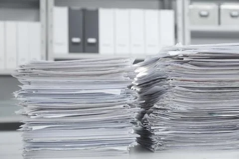 Stacks of documents on table in office Stock Photos