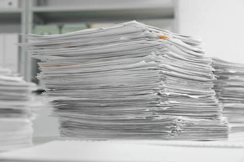 Stacks of documents on table in office Stock Photos