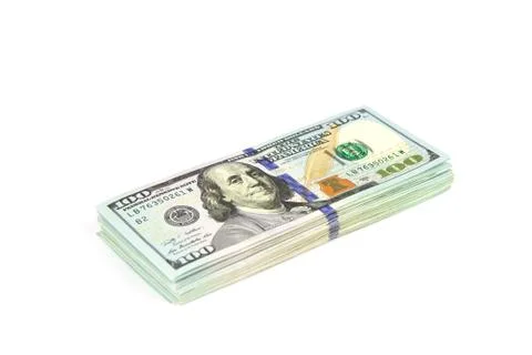 Stacks of dollars isolated on a white background. Close up Stock Photos