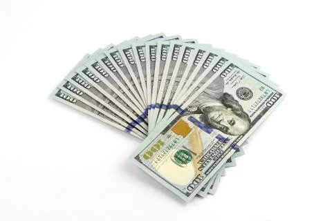 Stacks of dollars on a white background Stock Photos