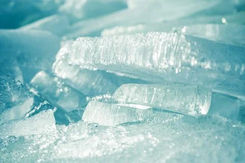 Stacks of drift ice piled up against the dutch coast with crystal clear sunli Stock Photos