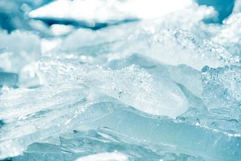 Stacks of drift ice piled up against the dutch coast with crystal clear sunli Stock Photos