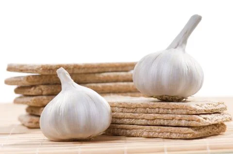 Stacks of dry crisp bread slices with garlic Stock Photos