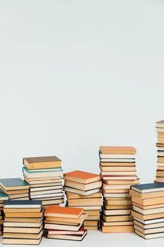 Stacks of educational books for teaching in the library on a white background Stock Photos