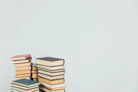 Stacks of educational books for teaching in the library on a white background Stock Photos