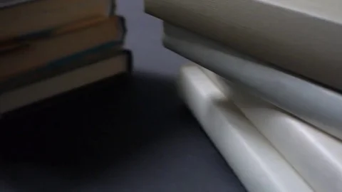 Stacks of folded books. The movement of the camera dolly. 動画素材 73462099