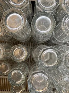 Stacks of glasses closeup view with selective focus on foreground Stock Photos