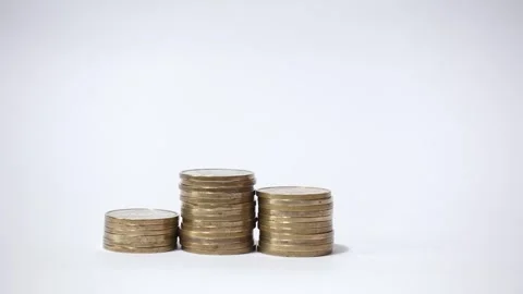 Stacks of golden coins gradually decreasing and disappearing one by one on 库存影片 313234391