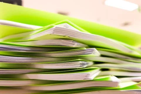 Stacks of green document on desk,office concept background Stock Photos