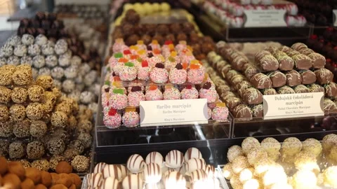 Stacks of handcrafted marzipan sweets in a rainbow of colors and textures. From  Video stock 306677450