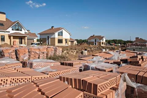 Stacks of hollow bricks at construction site Stockfoto's