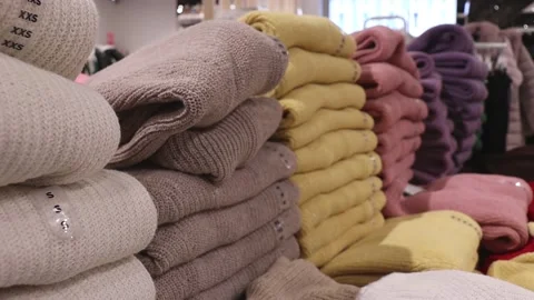 Stacks of knitted wool sweaters Stock Footage 219820844