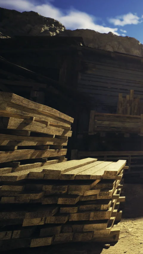 Stacks of lumber basking in warm sunlight at a rustic wood yard Stock Footage 331831072