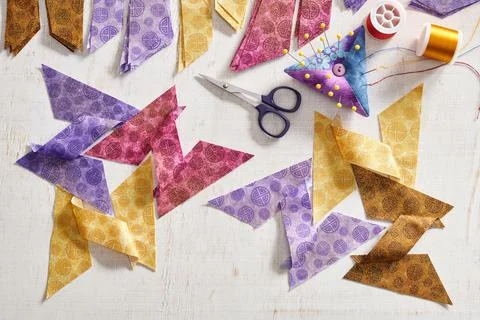 Stacks of multi-colored pieces of fabric, pieces of fabric sewn in the shape Z 스톡 사진