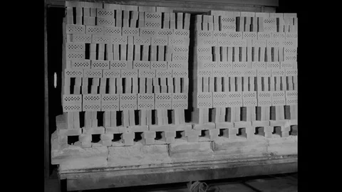 Stacks of new bricks transported across the company yard and stored, UK 1969 Stock Footage 132022754