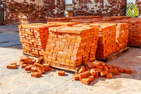 Stacks of new red brick at construction site 写真素材