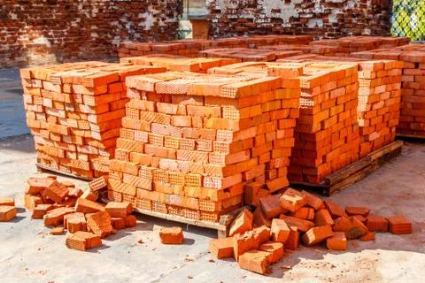 Stacks of new red brick at construction site 스톡 사진