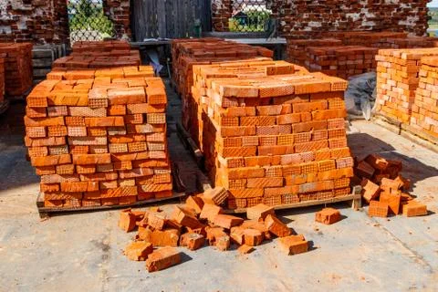 Stacks of new red brick at construction site Stock Photos