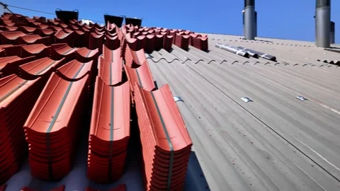 Stacks of new red tiles waiting for building roof repair, changing old by new Stock Footage 340824843