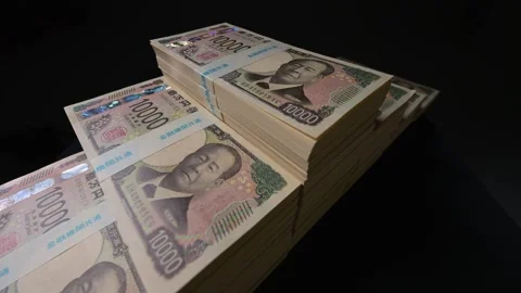 Stacks of new yen banknotes on black background Stock Footage 336765706