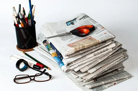 Stacks of newspapers that need to be read for business and financial information Stock Photos