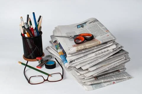 Stacks of newspapers that need to be read for business and financial information Stock Photos