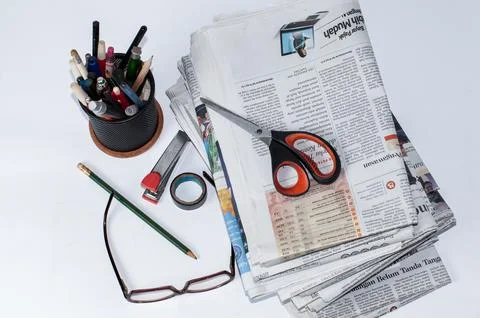 Stacks of newspapers that need to be read for business and financial information Stock Photos