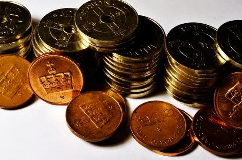 Stacks of Norwegian one and zero point five crown coin currency on white back Stock Photos