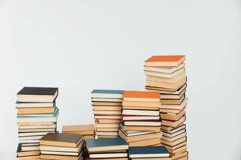 Stacks of old books in study library on white background Stock Photos