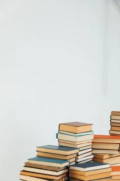 Stacks of old books in study library on white background Stock Photos