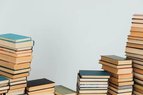 Stacks of old books in study library on white background Stock Photos