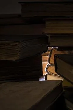 Stacks of old multi-format books with scuffs Stock Photos