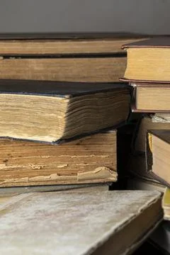 Stacks of old multi-format books with scuffs Stock Photos