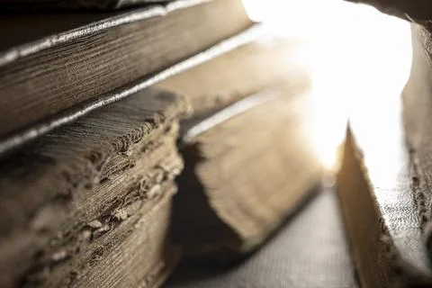 Stacks of old multi-format books with scuffs Stock Photos