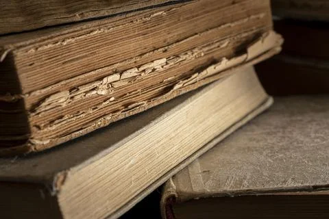 Stacks of old multi-format books with scuffs Stock Photos