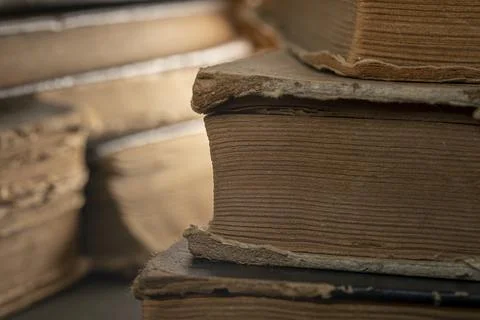 Stacks of old multi-format books with scuffs Stock Photos