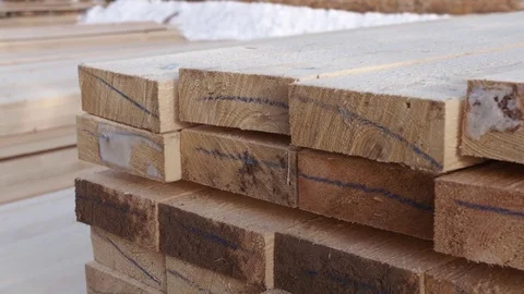 Stacks of packed lumber plank lying in yard of woodwork factory Stockbeeldmateriaal 85212588