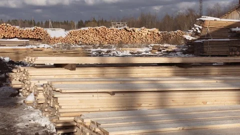 Stacks of packed lumber plank lying in yard of sawmill Stockbeeldmateriaal 85212611