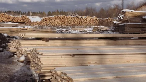 Stacks of packed lumber plank stored in yard of sawmill Stockbeeldmateriaal 85212581