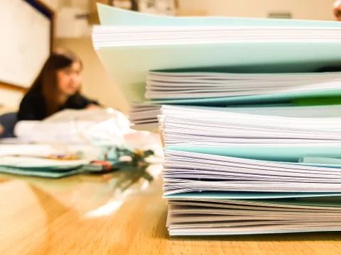 Stacks of Paper book and document with blur working women,office and finance  Stock Photos