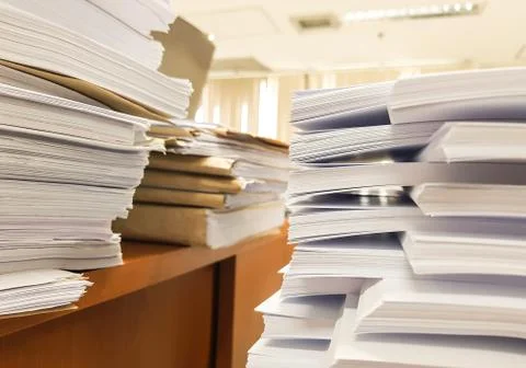 Stacks Paper document on the table,office background. Stock Photos