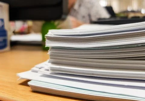 Stacks of paper on office background. Foto stock