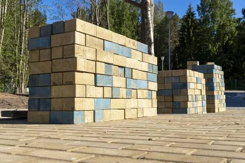 Stacks of paving slabs for paving paths stacked on a construction site Stock Photos