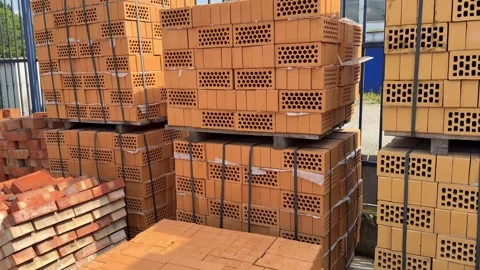 Stacks of perforated clay bricks at construction site Stock Footage 314131828