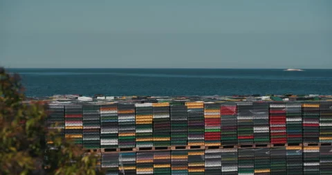 Stacks of Plastic Fish Crates by the Sea Video stock 335347380