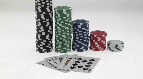 Stacks of poker chips sit in a row, arranged by value Stock Footage