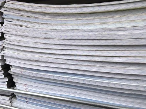 Stacks of printed paper awaiting use in an organized workspace 스톡 사진