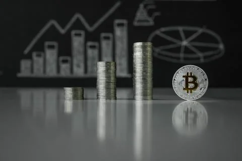 Stacks of silver bitoyins. Crypto currency. BTC. Virtual currency Stock Photos